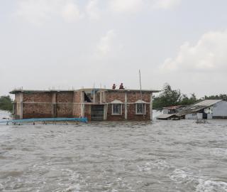 A house half-submerged by floods in West Bengal, India. 
