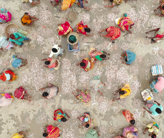 aerial shot of women at a fishing dock