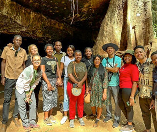 Journalists gather in front of Mau Mau Caves in Karura Forest, Nairobi
